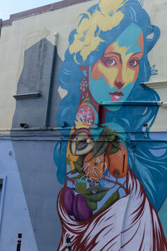 mural on the exterior of east-facing wall of 1473 Dundas St W referred to as &ldquo;Have You Ever Seen the Rain&rdquo; by Paul Jackson, Toronto