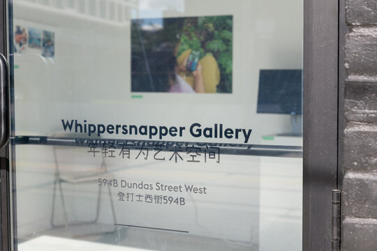 door sign at Whippersnapper Gallery, an art gallery, located at 594 Dundas St W, Toronto