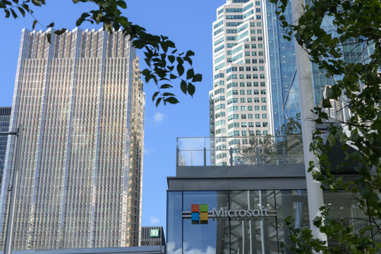 looking north on Bay St outside CIBC Square to Microsoft sign, and two office towers: (left) Royal Bank Plaza South and TD Place/Brookfield Place, Toronto