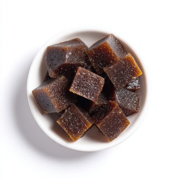 New Year Awurudu dodol dark brown jaggery pudding isolated on a white background