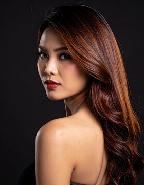 portrait of a woman looking over her shoulder 