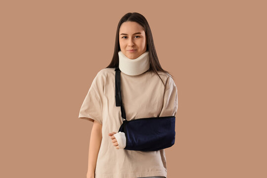 Personal injury and medical recovery, young woman wearing a neck brace and arm sling after a physical accident or trauma in a healthcare setting
