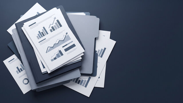 office documents and financial reports on navy desk