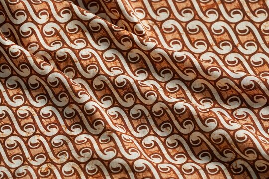 Elegant batik parang diagonal pattern in copper brown on cream, Javanese textile motif