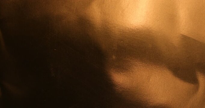 Abstract golden brown metallic background texture with scratches and
