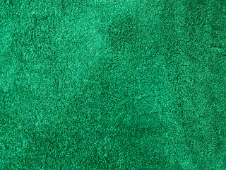 Seamless emerald green velvet carpet fabric texture background. © ddprasetya