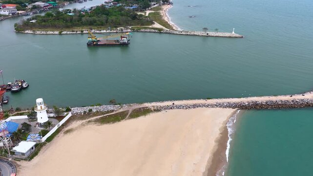 Aerial View of Crane Ship Navigating Coastal Estuary Waters
