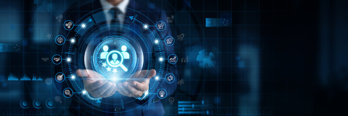Obraz premium Human Resources Manager holding and controlling Human Resources network interface with digital and employee data. Talent management, recruitment, workforce planning, employee engagement