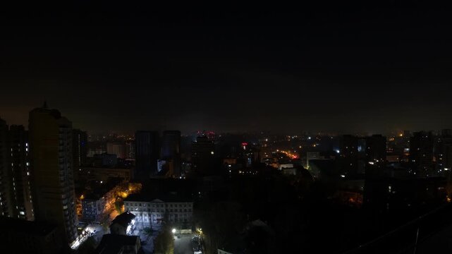 Night city timelapse with setting moon