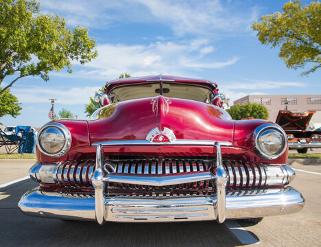 Front view of a red 1951 Mercury Eight classic car