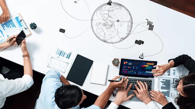 A dynamic business team engages in data analysis and strategic planning. The setting showcases modern technology and global connectivity in a professional workspace. Raster