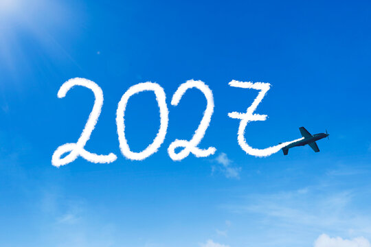 Airplane Writing 2027 in the Sky with White Cloud Vapor Trail