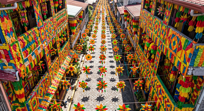 Aerial view of Pahiyas Festival in Lucban, street of houses decorated with colorful kiping rice wafers, Quezon Philippines, harvest festival