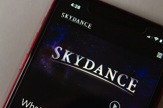 Quetzaltenango, GUATEMALA - 13 Oct 2026 : Smartphone displaying the Skydance homepage, with the silver serif logo set against a starry purple space image and a play button below.