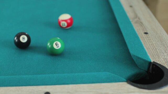 Close-up view of numbered pool balls on blue billiard cloth