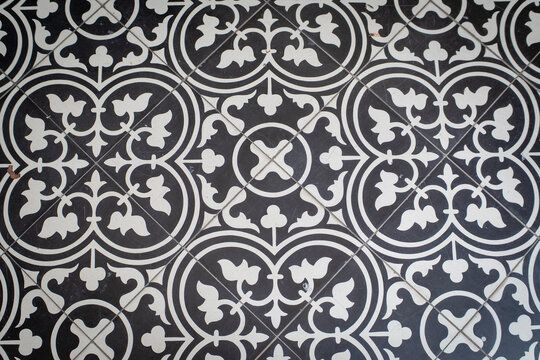 Top-down flat lay view of patterned vintage floor tiles for interior design background.