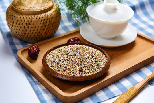 Mixed tri-color quinoa grains in blue ceramic plate