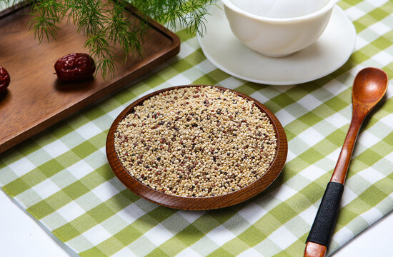 Mixed tri-color quinoa grains in blue ceramic plate