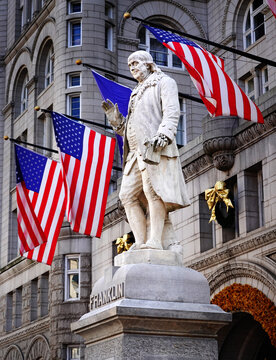 Statute of Benjamin Franklin in Washington DC with American Flag