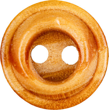 Closeup honey brown round wooden two hole sewing button for craft