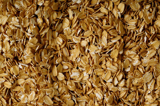 Oat flakes textured pattern, rolled oatmeal macro background