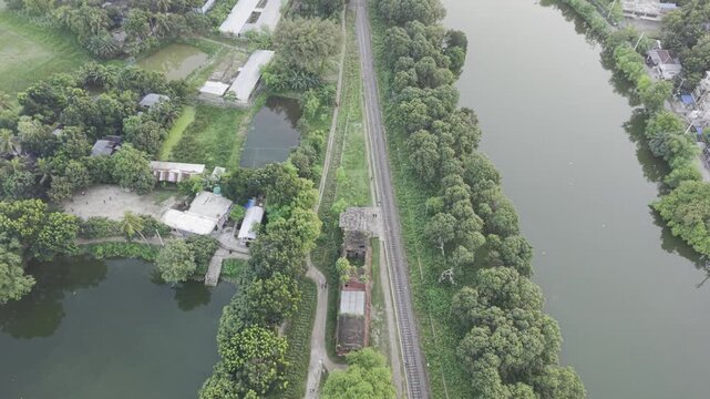 Aerial view of railway tracks through a green rural landscape