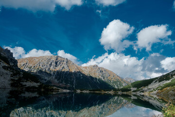 A mountain pond reflecting the peaks. Czarny Staw pod Rysami. High Tatras. © Tomasz