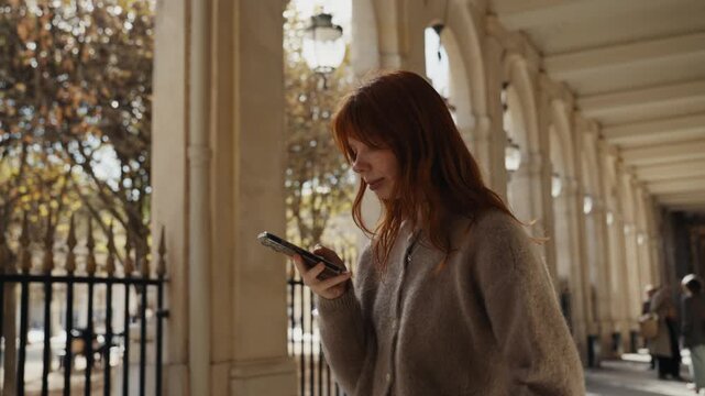 Redhead woman tourist taking pictures in paris
