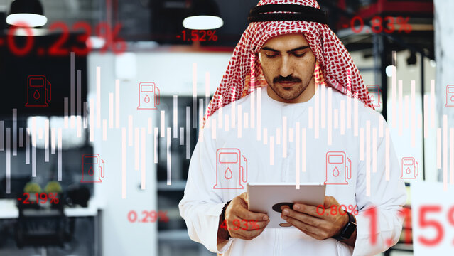 Fuel oil crisis at gas station with worker checking data on tablet
