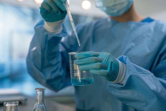 Team scientists research natural skincare products in a modern laboratory, testing formulas, analyzing ingredients, and driving cosmetic innovation and development.