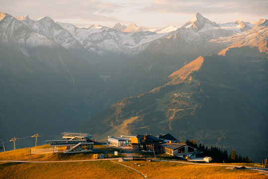Zell am See ski resort sits under mountains at sunset in Austria