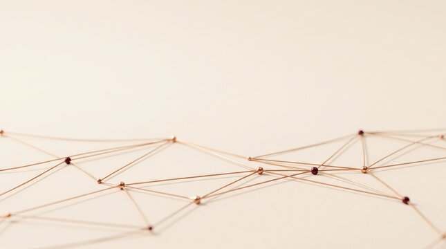 Minimalist jewelry arrangement featuring gold necklaces and delicate bracelets on sand