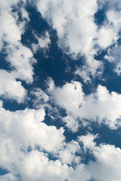 Cumulus fractus clouds against a blue sky