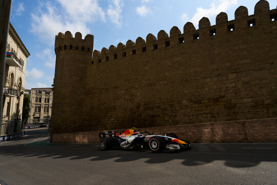 BAKU, AZERBAIJAN - SEPTEMBER 2026: Racing Bulls RB F1 Team car races alongside the historic Old City fortress wall during the Azerbaijan Grand Prix