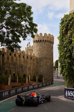 BAKU, AZERBAIJAN - SEPTEMBER 2026: Oracle Red Bull Racing F1 Team car navigates the narrow Old City castle section during the Azerbaijan Grand Prix