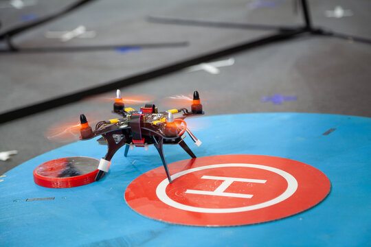 A hobbyist quadcopter takes off from a training area