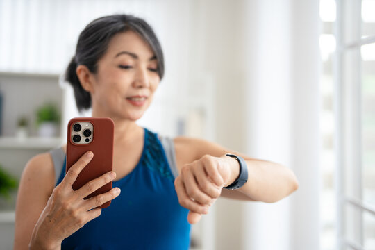 Home, fitness  woman with phone browsing web or app for workout , online platform for tutorial.