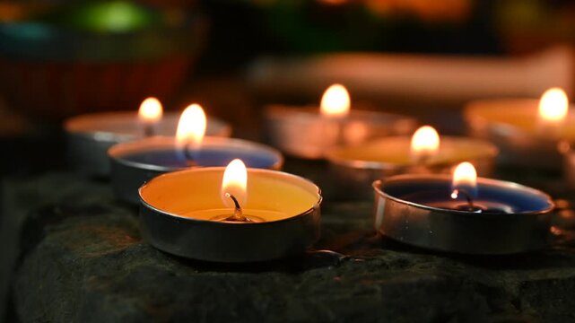 Traditional clay oil lamps with glowing flames creating a warm and festive atmosphere during Diwali celebrations