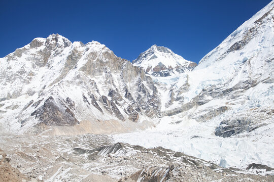 Mountains and glaciers in the Himalayas under clear blue sky during midday