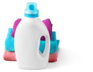 Obraz na płótnie Canvas Bottle of laundry detergent next to stacked towels of various colors in a home setting