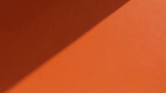 Terracotta orange wall with diagonal shadow, bold minimal background