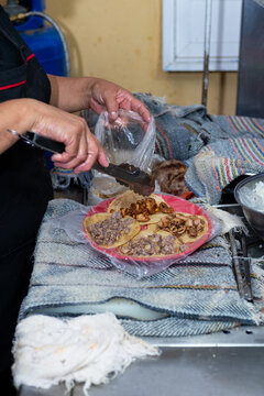 Female Hands Preparing Tacos at a Mexican Street Taqueria