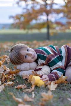 Cute child in the park autumn time