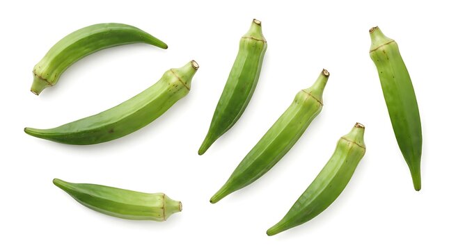 Fresh green okra pods arranged in a group, showcasing their elongated shape, textured skin, and vibrant color, isolated on a white background