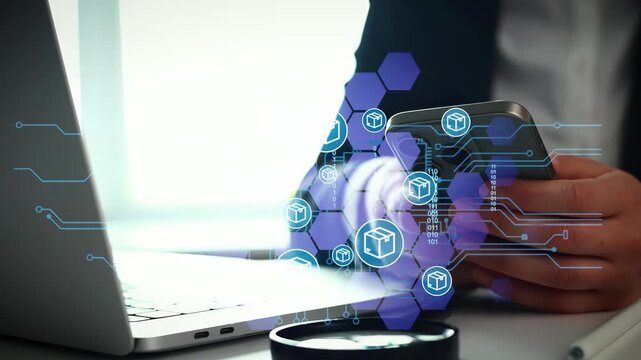 A person is using a smartphone while sitting at a desk with a laptop. Visual elements suggest technology and business themes in a modern office space.