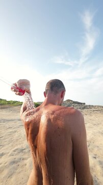 Vertical shot van life outdoor shower in nature, Italy