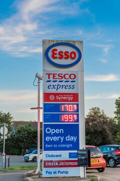 Esso petrol station sign displaying petrol and diesel prices amid rising fuel costs.