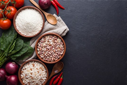 African staple ingredients flat lay on dark slate
