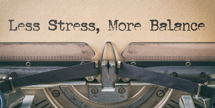 Text written with a vintage typewriter - Less Stress, More Balance