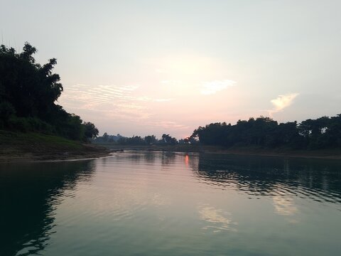 sunset on the river. Scenic view of beautiful sunset or sunrise above the lake